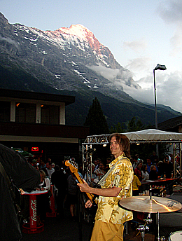 Charlie Morris on stage in Grindelwald, with the Eiger in the background