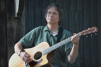 Charlie Morris with acoustic guitar - color promo shot. Click on this thumbnail to view the high-resolution photo.