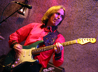 Charlie licks it at the Buehler Blues Club. Photo by Werner Gmuender.