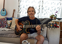 Charlie Morris with Gibson jazz guitar - color promo shot. Click on this thumbnail to view the high-resolution photo.